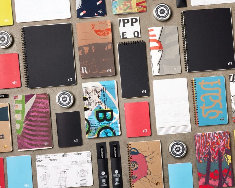 a collection of printed paper notepads
